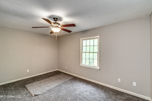 unfurnished room with ceiling fan, a textured ceiling, and carpet