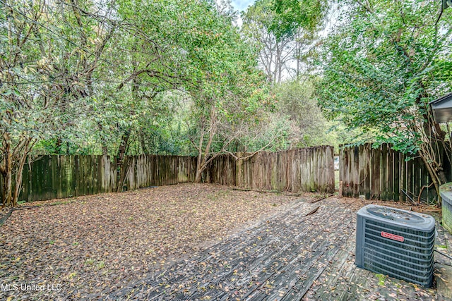 view of yard featuring central air condition unit