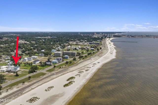 birds eye view of property featuring a view of the beach and a water view