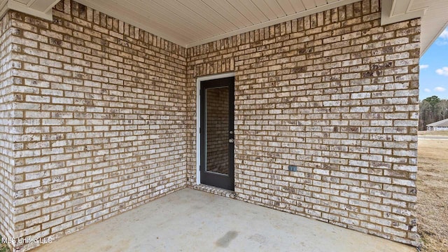 property entrance featuring a patio area