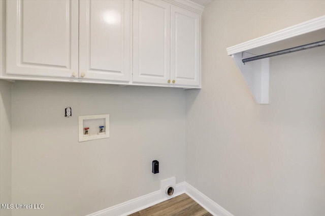 453 Abbey Woods, Brandon, MS 39047 - washroom with hookup for a washing machine, cabinet space, baseboards, hookup for an electric dryer, and wood finished floors