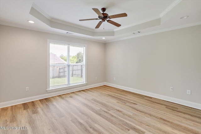 453 Abbey Woods, Brandon, MS 39047 - spare room featuring a raised ceiling, crown molding, light wood-style floors, recessed lighting, and baseboards