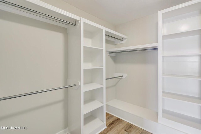 453 Abbey Woods, Brandon, MS 39047 - walk in closet featuring wood finished floors