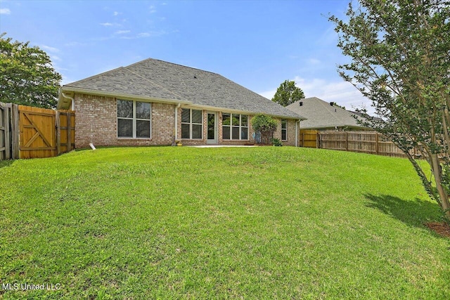 453 Abbey Woods, Brandon, MS 39047 - rear view of property featuring brick siding, a gate, and roof with shingles
