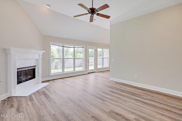 453 Abbey Woods, Brandon, MS 39047 - unfurnished living room with wood finished floors, ceiling fan, baseboards, a tiled fireplace, and crown molding