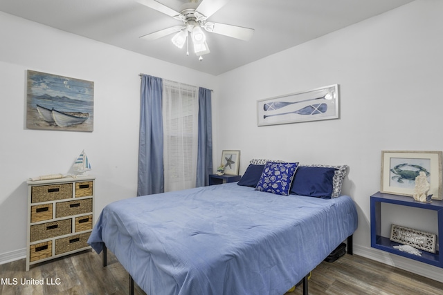 bedroom with ceiling fan and dark wood-type flooring