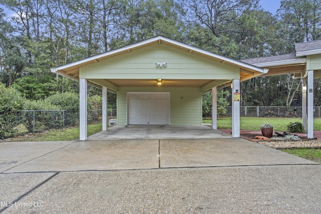 exterior space with a carport and a lawn