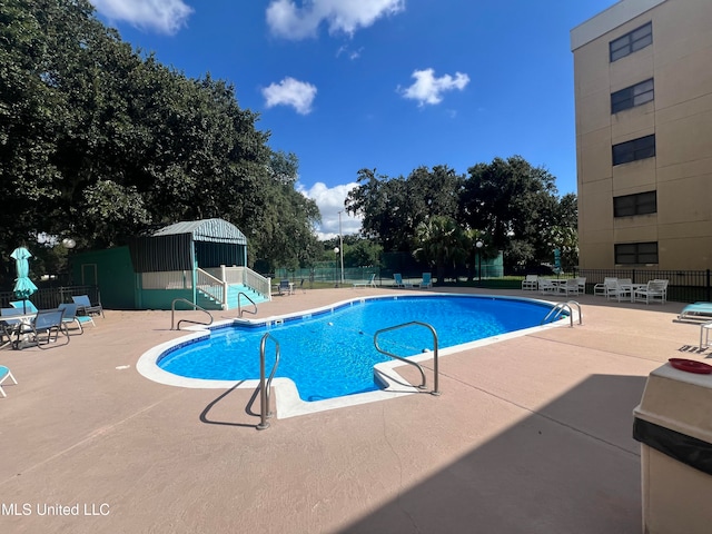 view of swimming pool with a patio