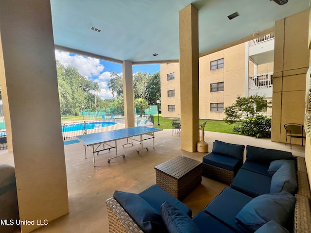 view of patio with a community pool