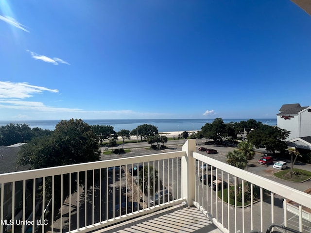 balcony featuring a water view