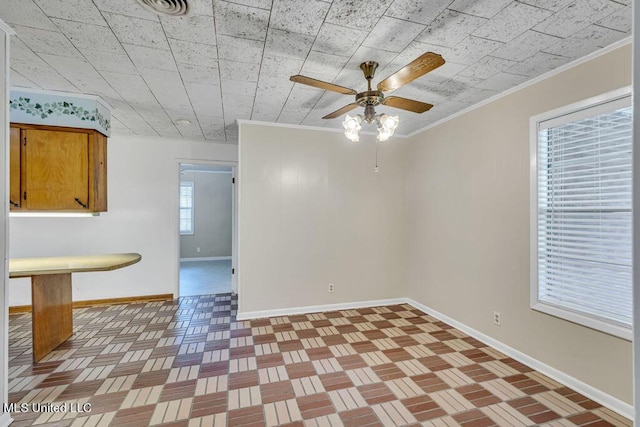 20332 Red Bird Hill Rd, Gulfport, MS 39503 - empty room with baseboards, crown molding, and a ceiling fan