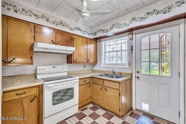 20332 Red Bird Hill Rd, Gulfport, MS 39503 - kitchen featuring under cabinet range hood, white electric range, a sink, and light countertops