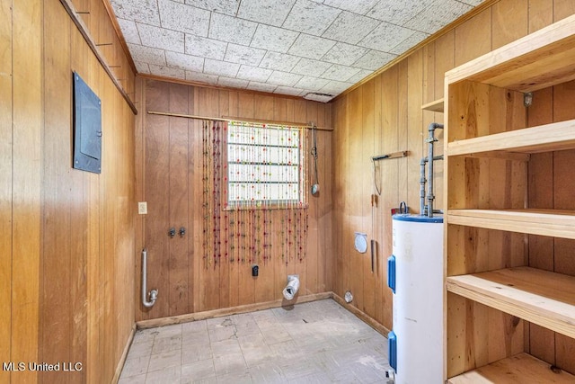 20332 Red Bird Hill Rd, Gulfport, MS 39503 - clothes washing area with water heater, wooden walls, and baseboards