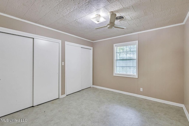 20332 Red Bird Hill Rd, Gulfport, MS 39503 - unfurnished bedroom with crown molding, multiple closets, baseboards, and carpet floors
