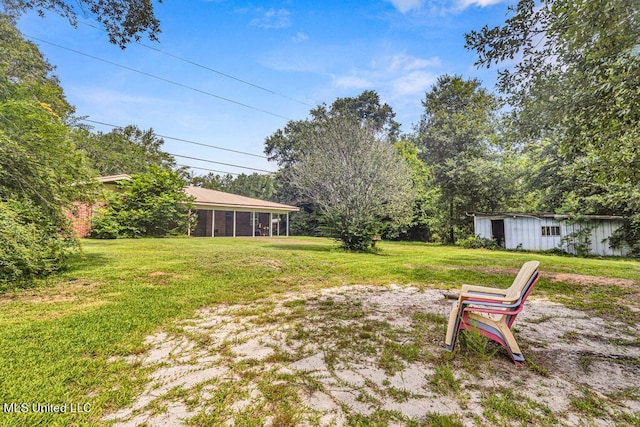 20332 Red Bird Hill Rd, Gulfport, MS 39503 - view of grassy yard featuring a sunroom
