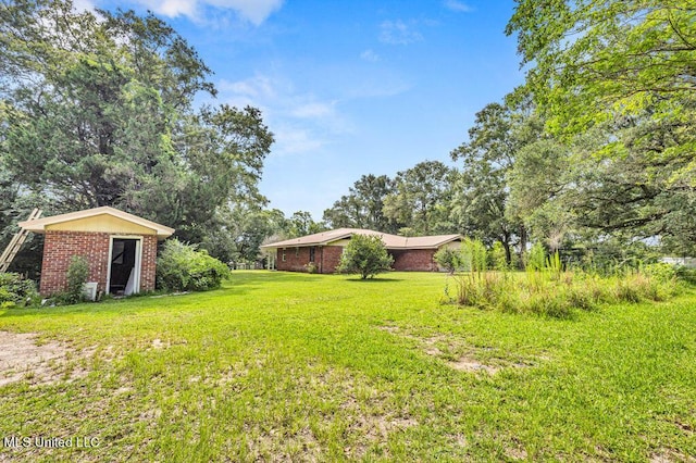20332 Red Bird Hill Rd, Gulfport, MS 39503 - view of grassy yard featuring an outbuilding