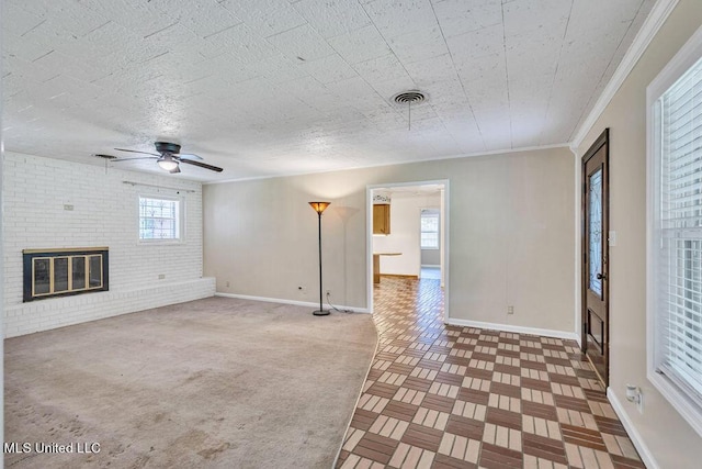 20332 Red Bird Hill Rd, Gulfport, MS 39503 - unfurnished living room with baseboards, a ceiling fan, a brick fireplace, and crown molding