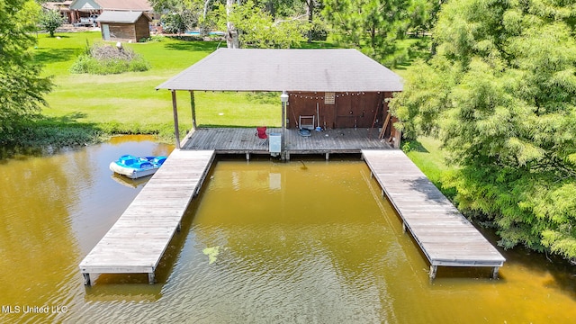 dock area with a yard and a water view