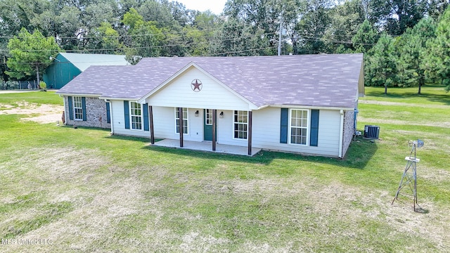 ranch-style house with central AC, a front yard, and a patio