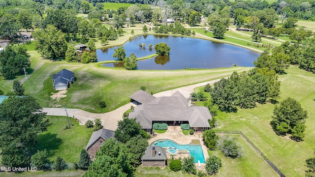 birds eye view of property with a water view