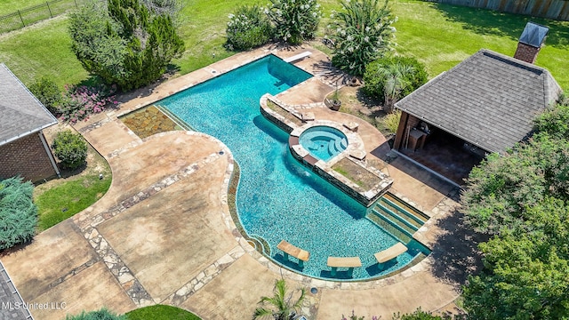 view of swimming pool featuring a patio area, an in ground hot tub, and a lawn