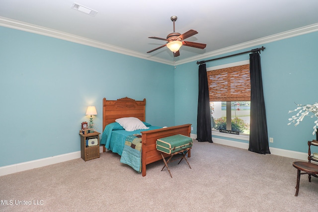 bedroom with ceiling fan, ornamental molding, and light colored carpet