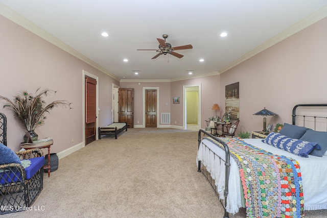 carpeted bedroom featuring ornamental molding and ceiling fan