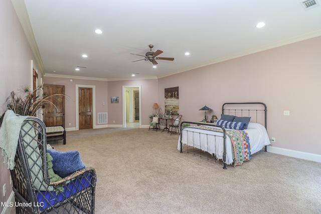 carpeted bedroom with ornamental molding and ceiling fan