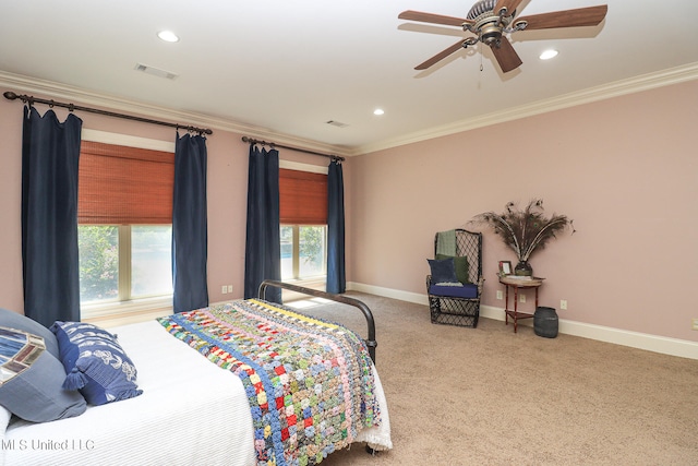 carpeted bedroom featuring ornamental molding and ceiling fan