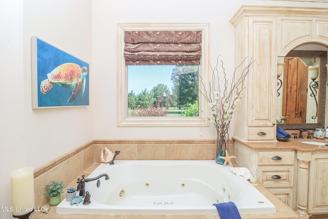 bathroom with tiled bath and sink