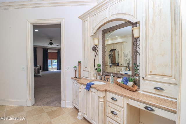 bathroom with vanity, crown molding, tile patterned flooring, and ceiling fan