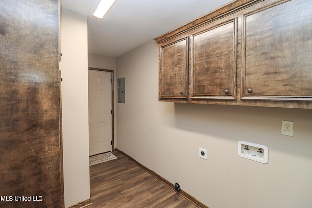 washroom featuring cabinets, dark wood-type flooring, electric dryer hookup, washer hookup, and electric panel