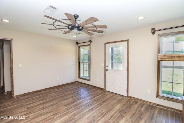 foyer with ceiling fan and dark hardwood / wood-style flooring