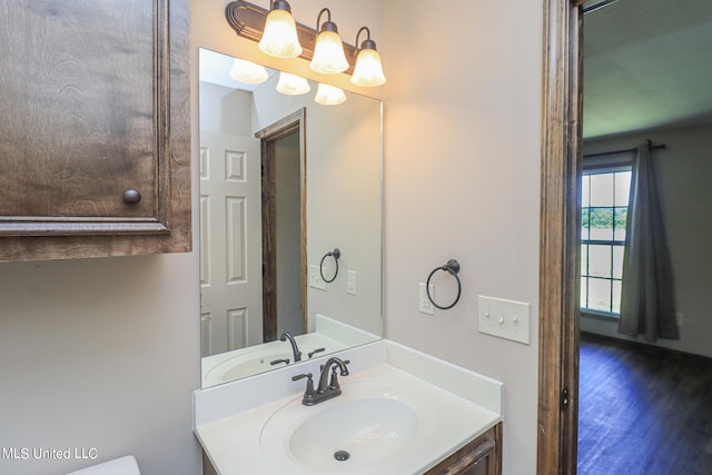 bathroom featuring vanity and hardwood / wood-style flooring