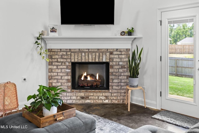 123 Bailey Cv, Canton, MS 39046 - living room with a brick fireplace and baseboards
