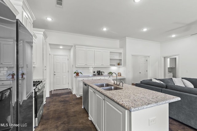 123 Bailey Cv, Canton, MS 39046 - kitchen featuring a sink, appliances with stainless steel finishes, white cabinets, backsplash, and open floor plan