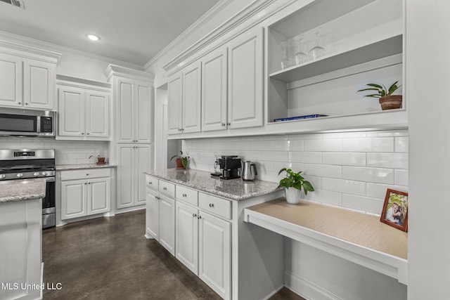 123 Bailey Cv, Canton, MS 39046 - kitchen with stainless steel appliances, open shelves, decorative backsplash, concrete floors, and ornamental molding