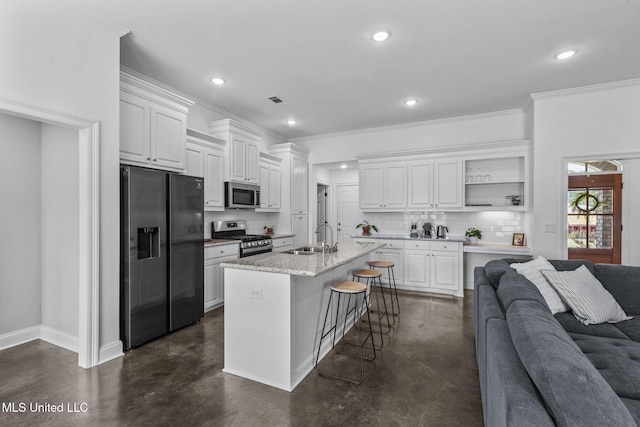 123 Bailey Cv, Canton, MS 39046 - kitchen featuring appliances with stainless steel finishes, a sink, concrete flooring, open floor plan, and recessed lighting