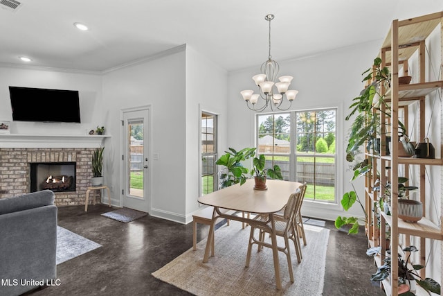 123 Bailey Cv, Canton, MS 39046 - dining room featuring finished concrete flooring, ornamental molding, baseboards, recessed lighting, and a chandelier