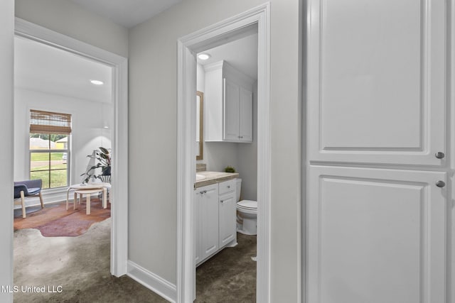 123 Bailey Cv, Canton, MS 39046 - corridor with concrete flooring and baseboards