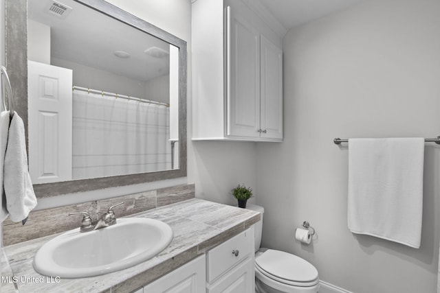 123 Bailey Cv, Canton, MS 39046 - full bath featuring vanity, toilet, a shower with curtain, and baseboards