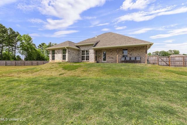 123 Bailey Cv, Canton, MS 39046 - back of property with brick siding and roof with shingles