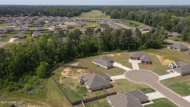 123 Bailey Cv, Canton, MS 39046 - aerial overview of property's location with a nearby body of water, a heavily wooded area, and nearby suburban area