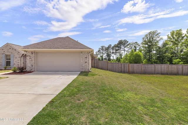 123 Bailey Cv, Canton, MS 39046 - view of property exterior featuring brick siding, driveway, a garage, and roof with shingles