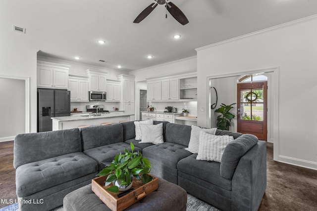 123 Bailey Cv, Canton, MS 39046 - living area with ornamental molding, baseboards, a ceiling fan, and recessed lighting