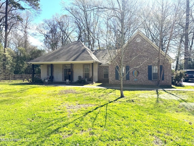 4 Bayou Ln, Natchez, MS 39120 - view of front of property featuring a front yard, covered porch, fence, and brick siding