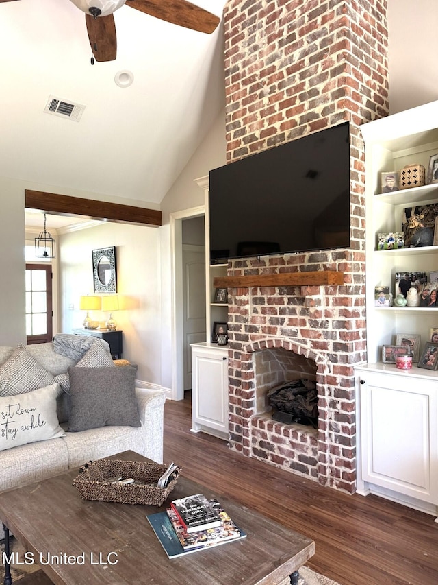 4 Bayou Ln, Natchez, MS 39120 - living room with a ceiling fan, dark wood-type flooring, a fireplace, and visible vents