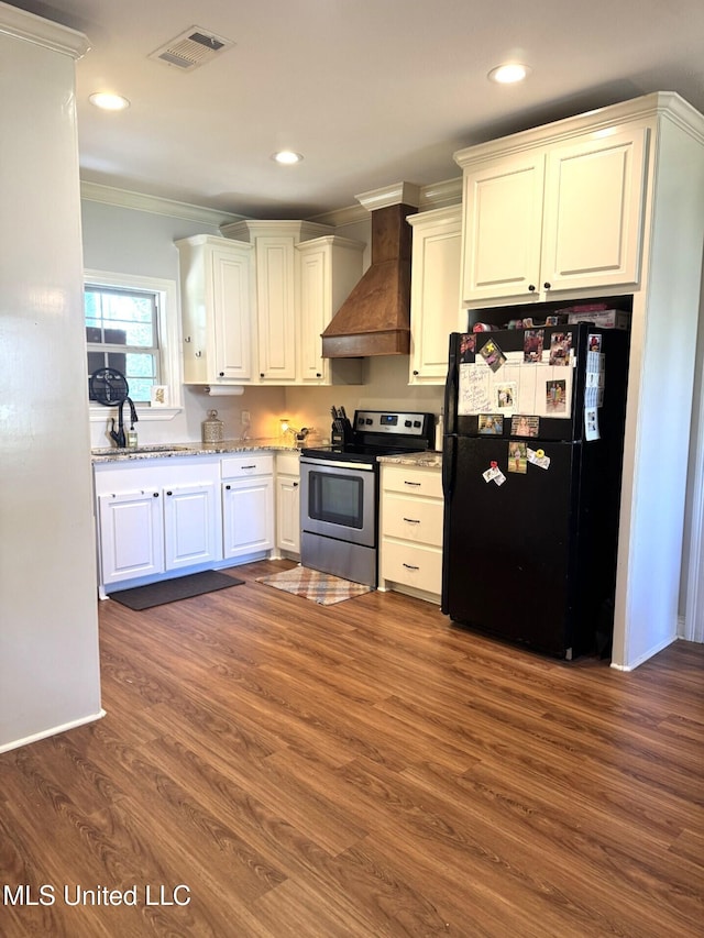 4 Bayou Ln, Natchez, MS 39120 - kitchen featuring ornamental molding, freestanding refrigerator, stainless steel electric range oven, custom exhaust hood, and dark wood-style flooring