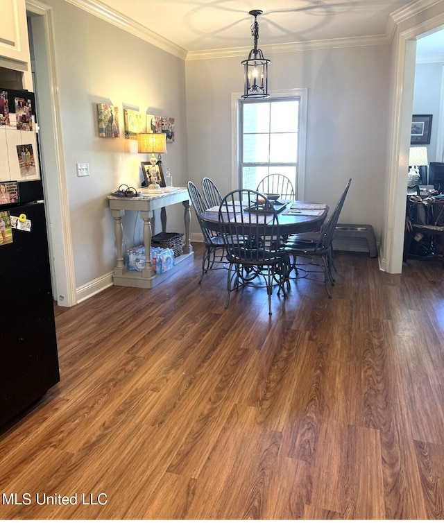 4 Bayou Ln, Natchez, MS 39120 - dining space featuring crown molding, a notable chandelier, wood finished floors, and baseboards