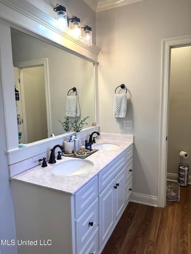 4 Bayou Ln, Natchez, MS 39120 - full bath with double vanity, wood finished floors, baseboards, and a sink